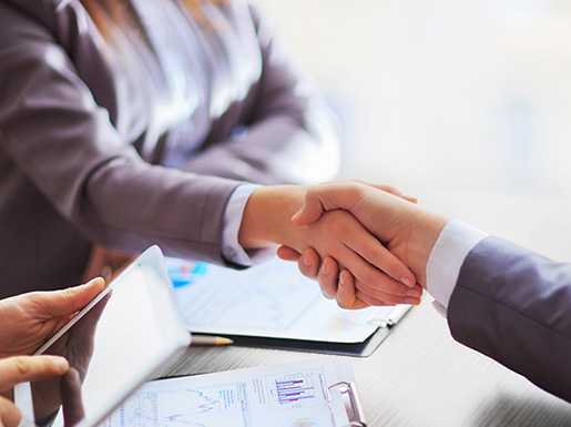 A man and woman shaking hands