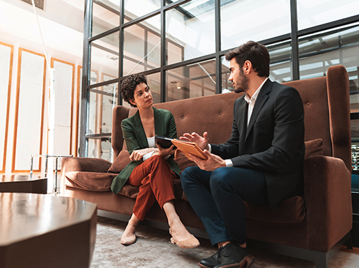 A business man and woman sitting