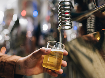 A man pouring beer into a glass