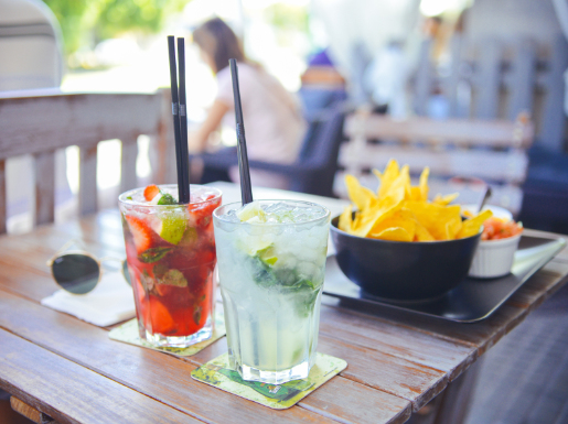 A table with drinks and chips