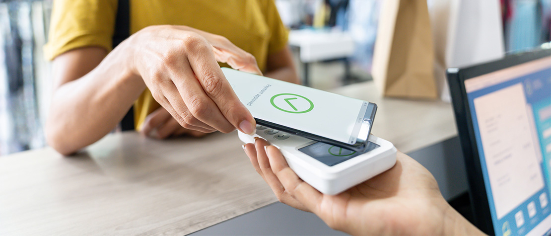 A phone using a scanner to make a payment